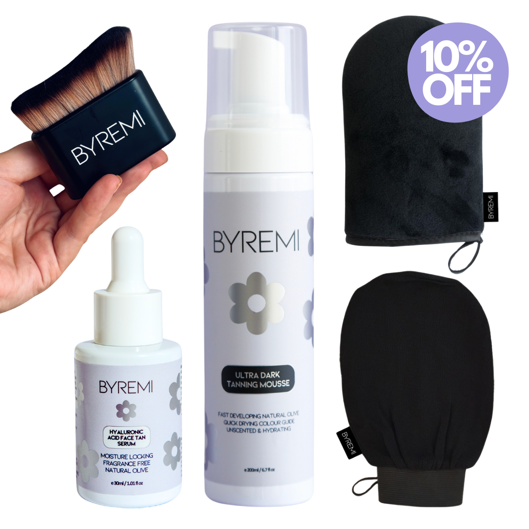 BYREMI tanning products including a brush, bottle, and mitt on a white background.