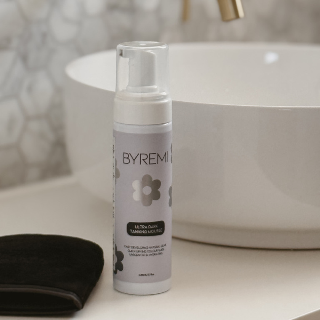 photo of byremi ultra dark gradual self tanning lotion and mitt on basin