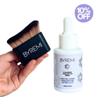 Hand holding a BYREMI brush and serum bottle with a 10% off label. Self Tanning NZ