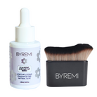 BYREMI serum bottle and kabuki blending brush on a white background