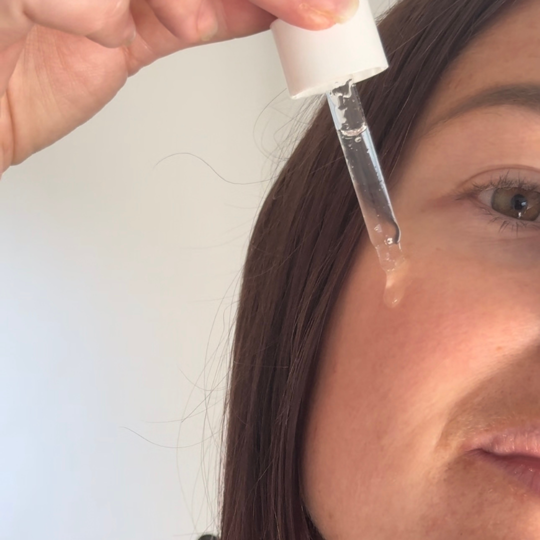 Model applying Byremi face tan water